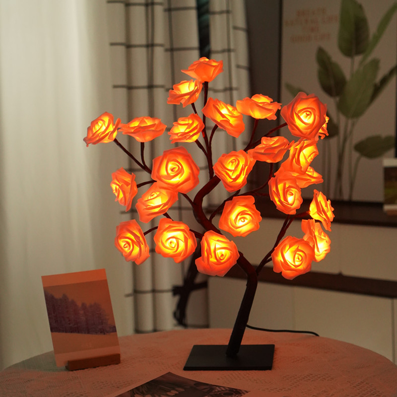 Rose Tree LED Table Lamp with orange lights on a table