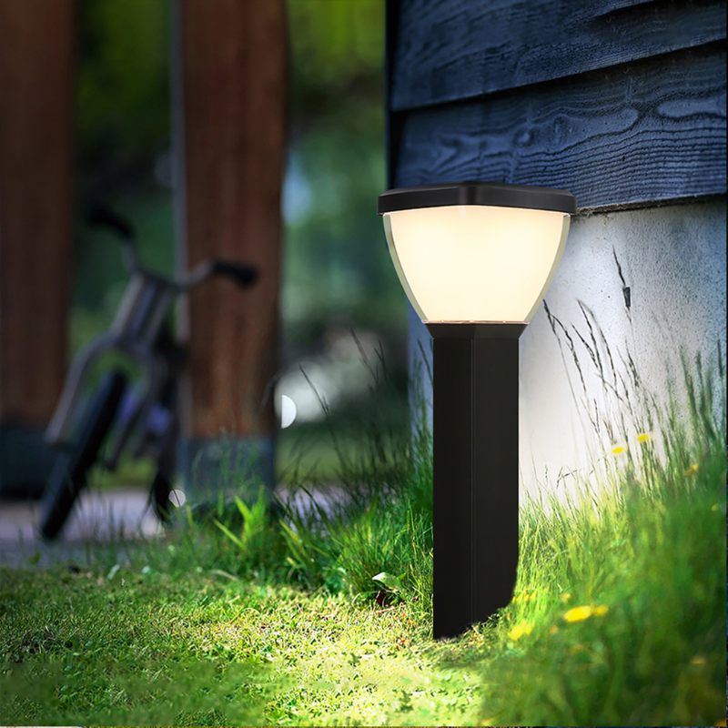 Waterproof Outdoor Solar LED Pillar Light illuminating a grassy area with a bicycle in the background